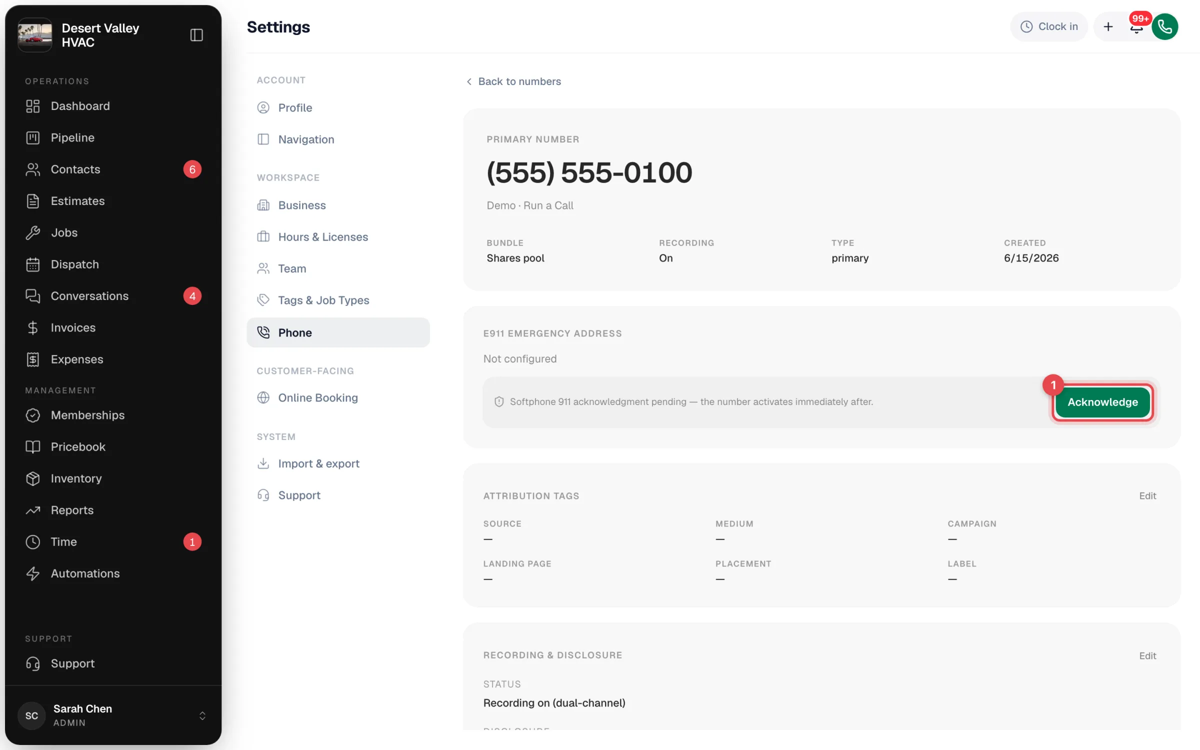 Number detail page showing the E911 emergency address section with the Acknowledge button highlighted
