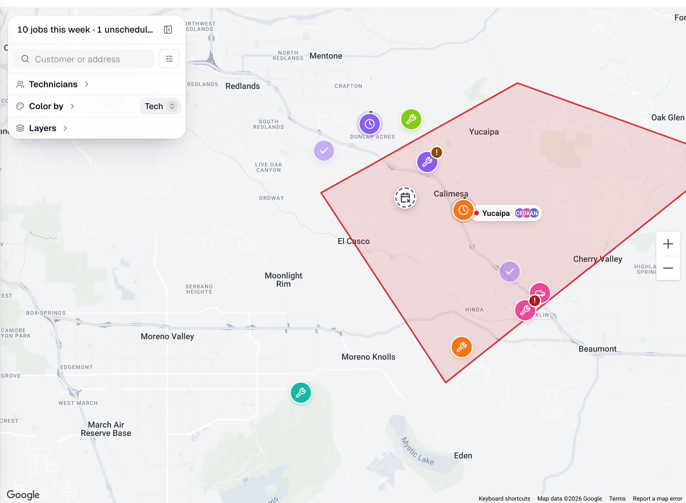 The dispatch map in Week view with job pins, a service zone and the side panel